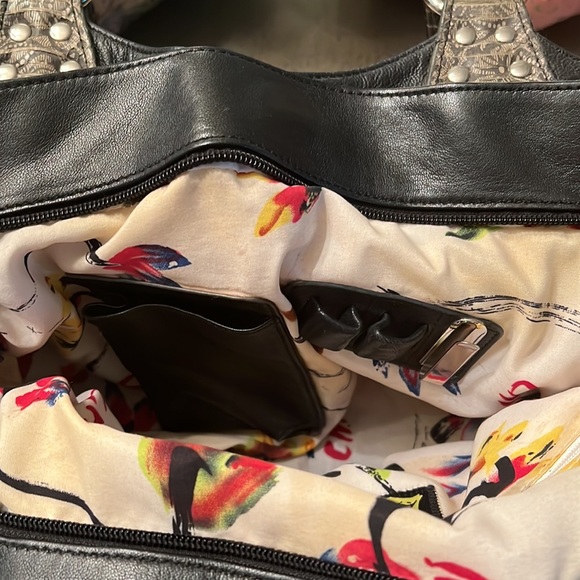 Black butter soft leather purse with grey snake handles and front pockets. - Picture 3 of 7